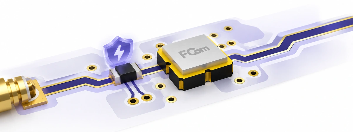 FCom SAW filter on a PCB with RF traces, ground vias and an ESD protection symbol near the input.